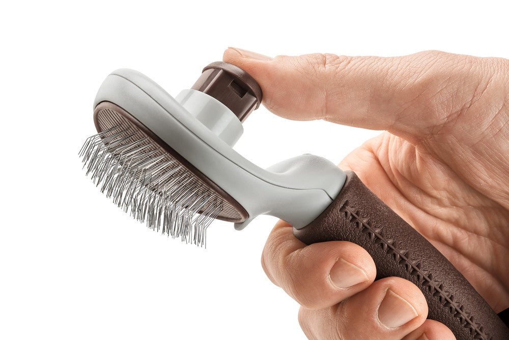 Self-Cleaning Slicker Brush SPA - Hunter-petstore -grooming brush for long-haired, medium-length and short-haired dogs -extra soft stainless steel pins for gentle fur grooming -makes it easier to remove dead topcoat and undercoat fur -integrated button allows you to easily remove collected fur, self-cleaning -ergonomic handle with high-quality leather look