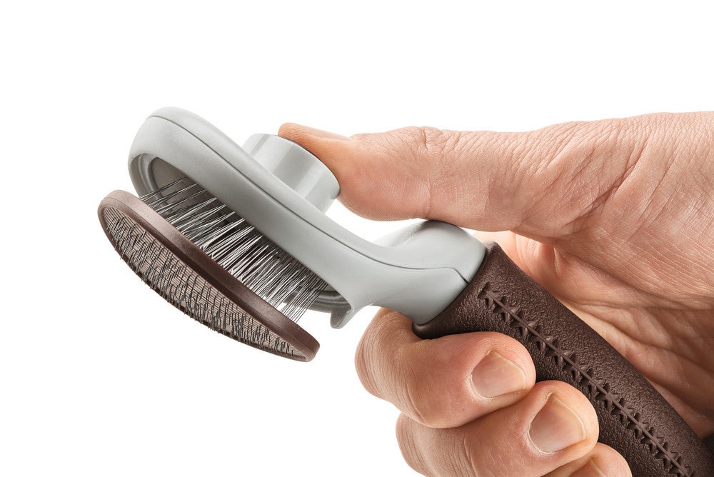 Self-Cleaning Slicker Brush SPA - Hunter-petstore -grooming brush for long-haired, medium-length and short-haired dogs -extra soft stainless steel pins for gentle fur grooming -makes it easier to remove dead topcoat and undercoat fur -integrated button allows you to easily remove collected fur, self-cleaning -ergonomic handle with high-quality leather look